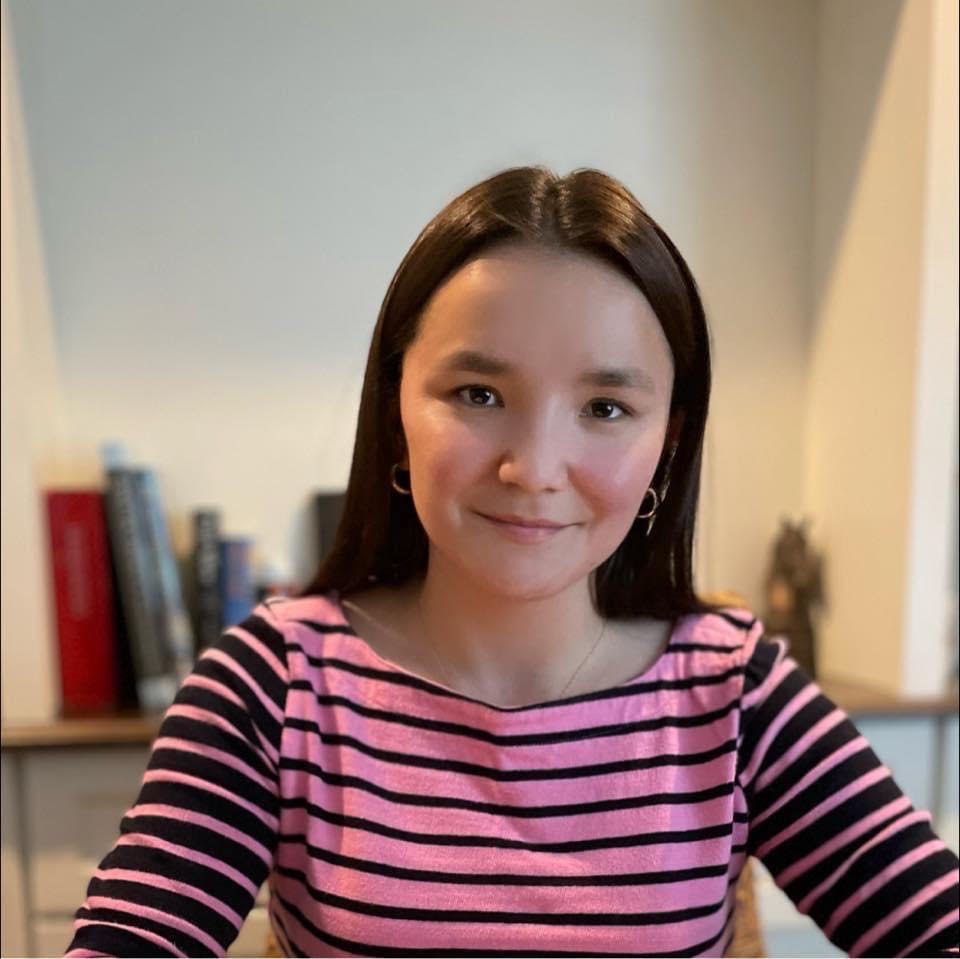 Abigail. Dark haired girl in a a pink shirt