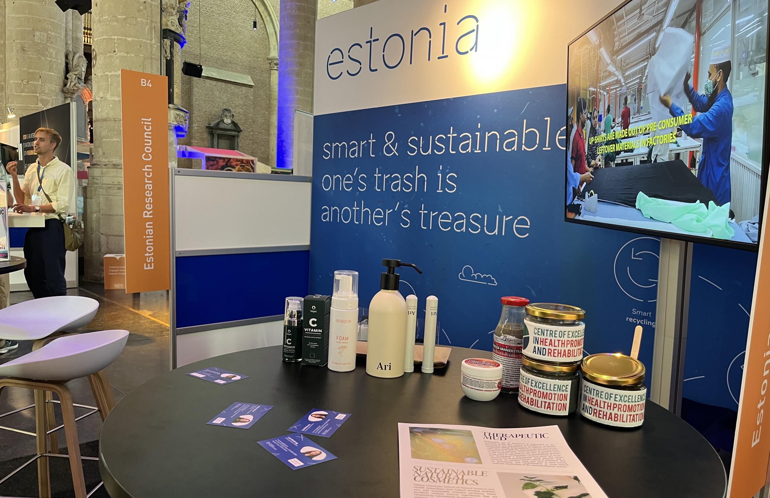 Cremes and therapeutic mud jars on a table, Estonian Research Council logo on the backround