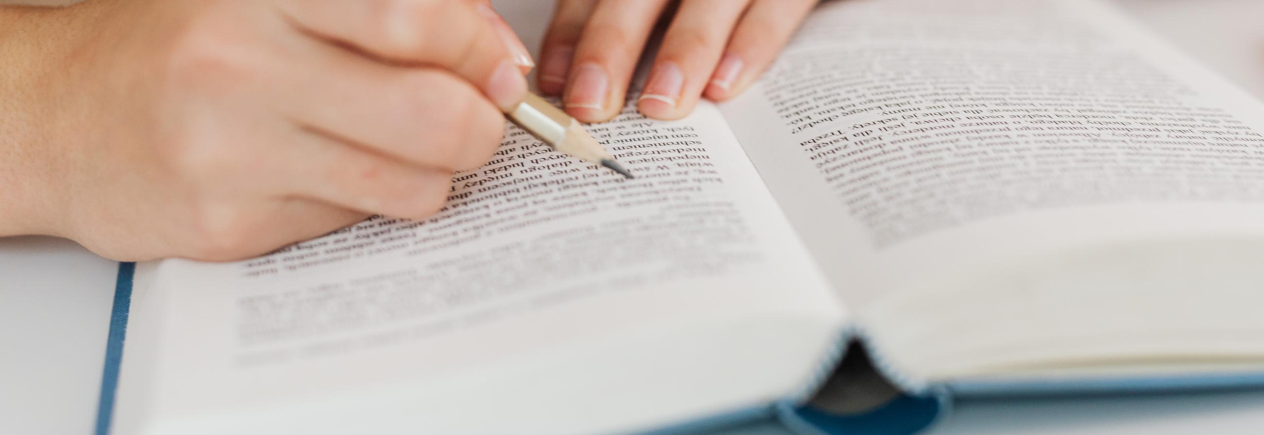 Photo by Karolina Grabowska: https://www.pexels.com/photo/woman-reading-and-writing-in-book-with-pencil-5877567/