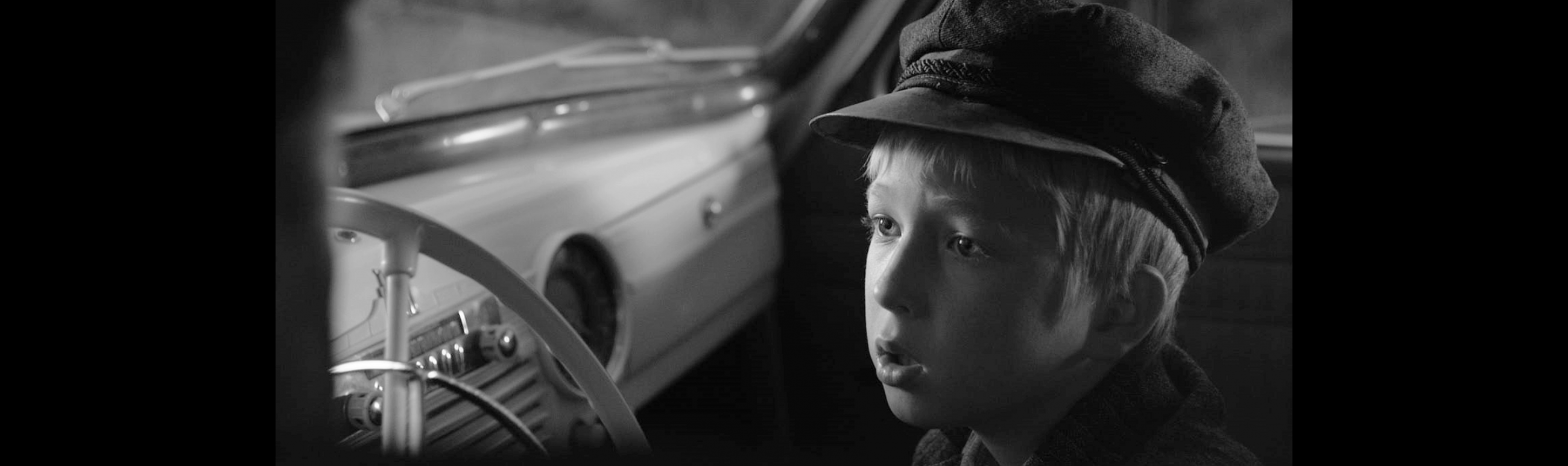 Young boy sitting in a car