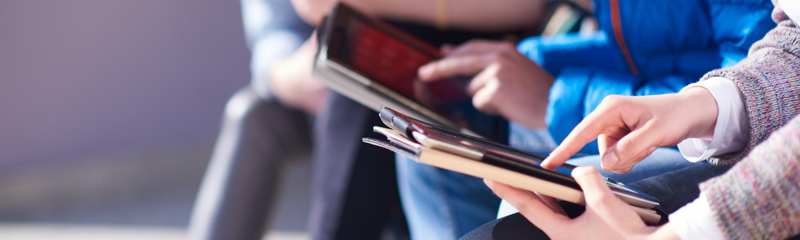 hands holding an ipad