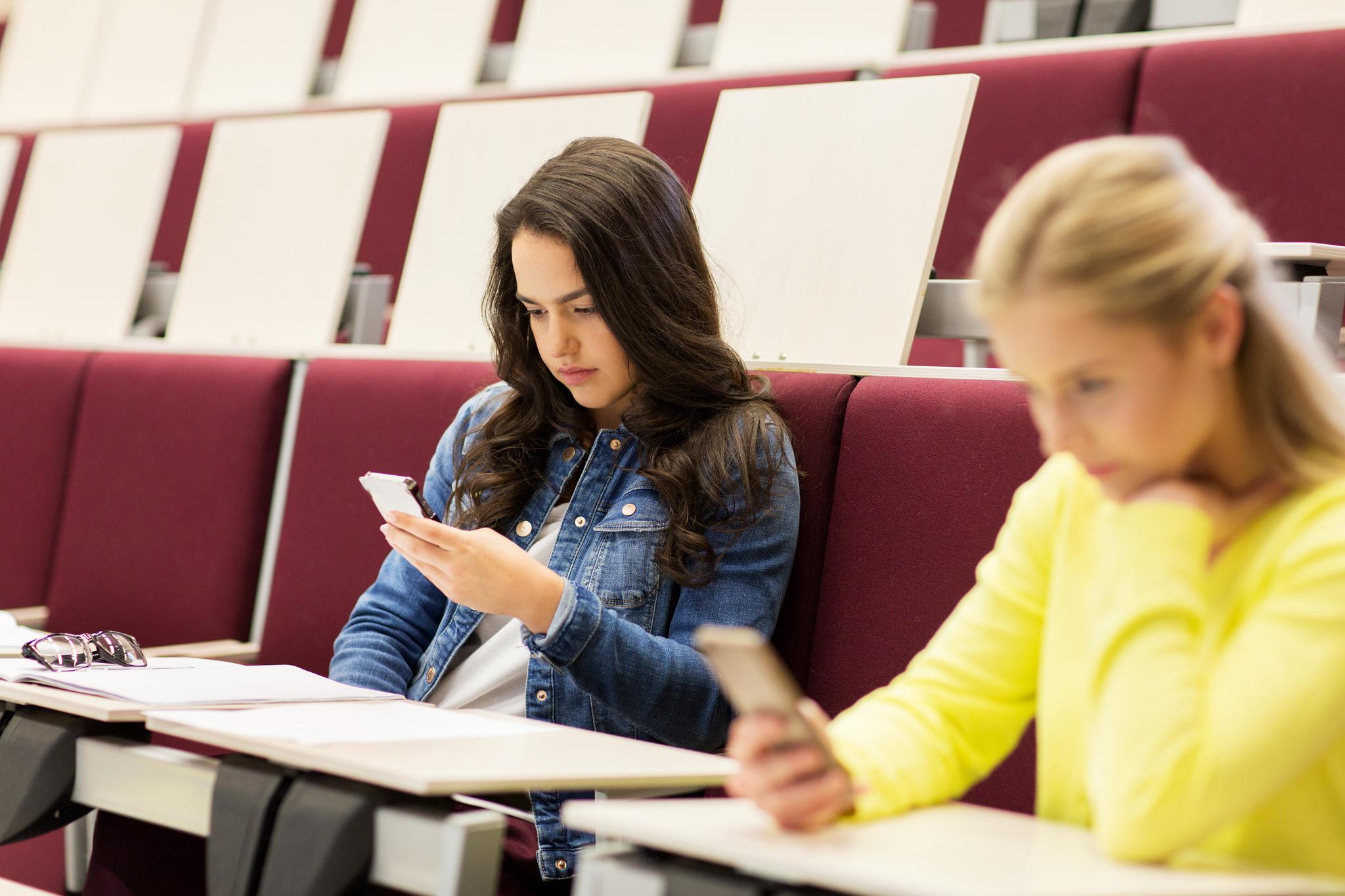 students looking at phones