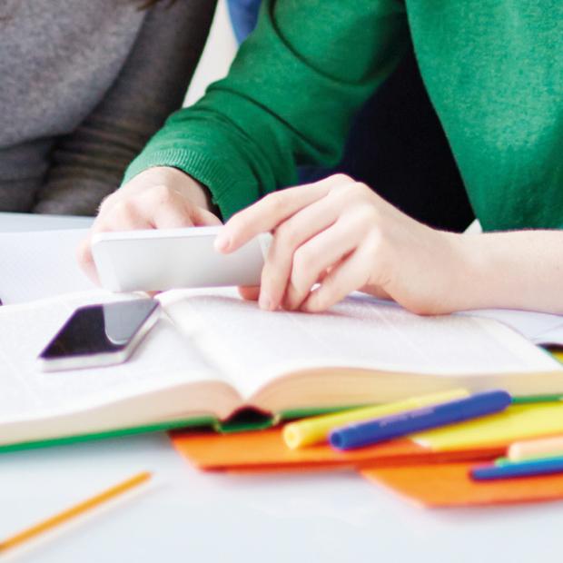 People learning, books on the table