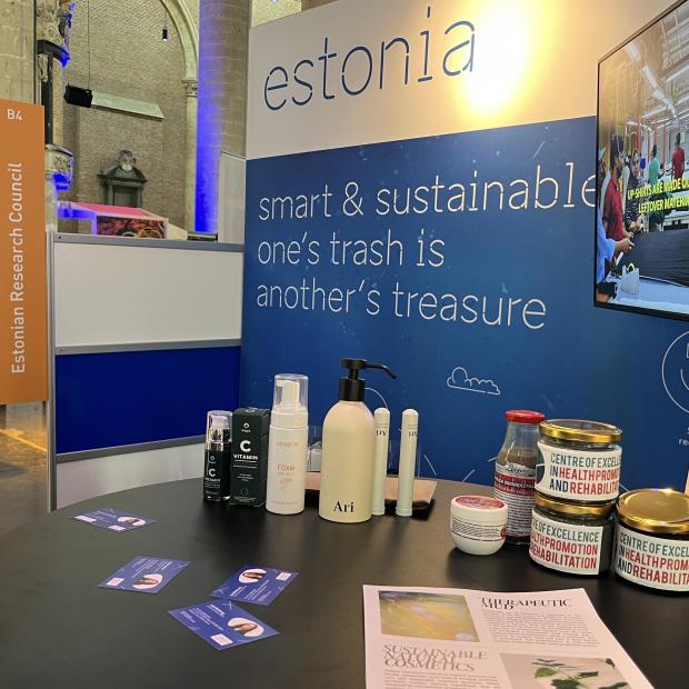 Cremes and therapeutic mud jars on a table, Estonian Research Council logo on the backround