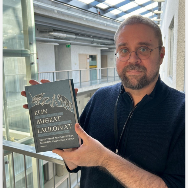 Alpo Seppo Santeri Honkapohja with his book